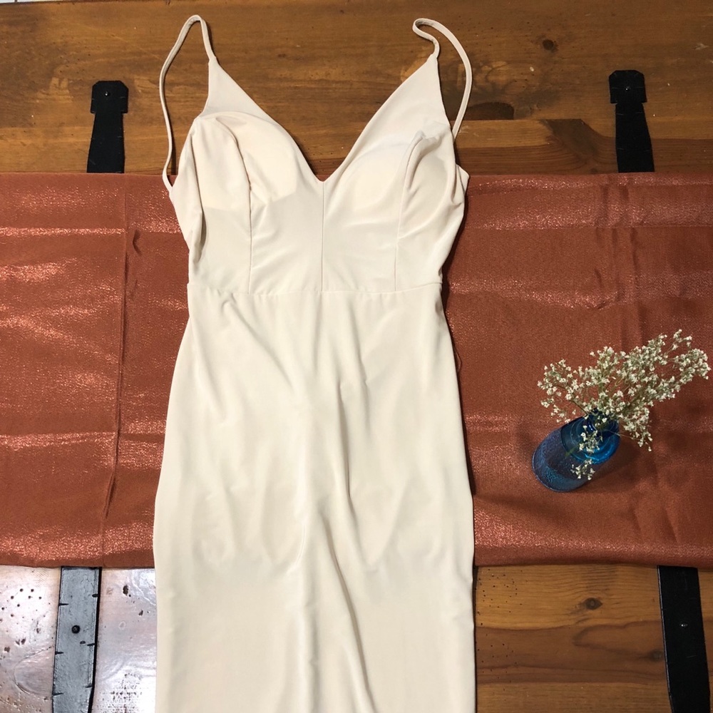 Beige dress with a low cut back